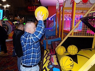 Diagrama Foundation: One of the Cabrini House residents shoots some hoops in the arcade during their holiday to Butlins.
